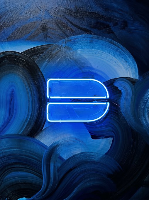 An abstract artwork features swirling blue brushstrokes with a glowing neon blue geometric shape resembling a stylized letter or symbol in the center.