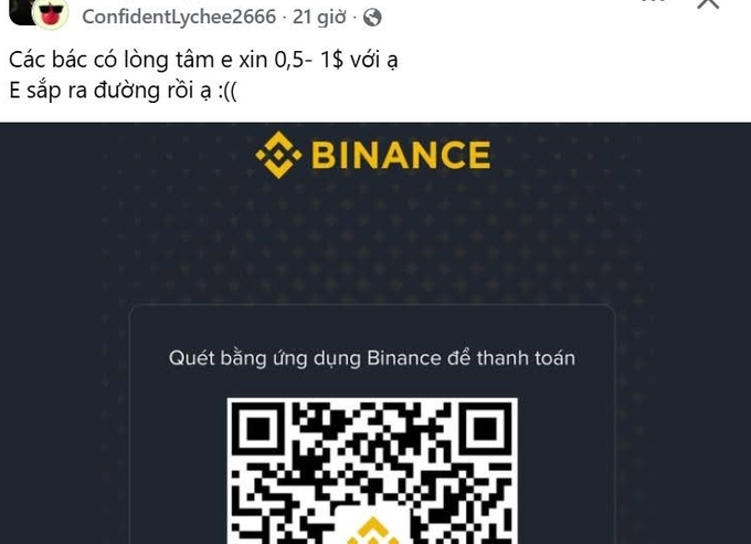 A user named "Confidentlychee2666" posted a Binance QR code with the message "Các bác có lòng tâm e xin 0,5-1$ với ạ, E sắp ra đường rồi a :((" asking the community for donations of $0.50-$1, claiming they're about to be homeless. The image exemplifies the satirical context of online crypto begging, where users share exchange QR codes to solicit small donations from strangers.