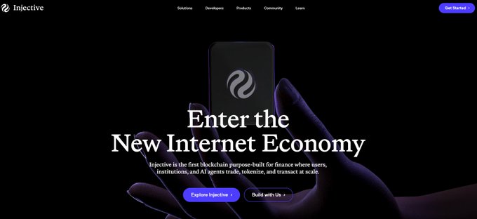 Injective's homepage displays the tagline "Enter the New Internet Economy" alongside imagery of a hand holding a smartphone featuring the Injective logo, promoting the platform as the first blockchain purpose-built for finance where users, institutions, and AI agents trade, tokenize, and transact at scale. The dark, sleek design with "Explore Injective" and "Build with Us" call-to-action buttons reinforces $INJ's positioning as foundational infrastructure for onchain finance rather than just another blockchain.