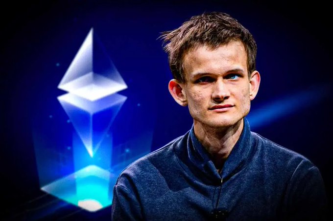 Vitalik Buterin, the co-founder of Ethereum, posing in front of a lit Ethereum (ETH) logo.