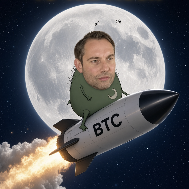 A humorous composite image showing a man's head photoshopped onto a green cartoon frog riding a rocket labeled "BTC" (Bitcoin) flying towards a large moon against a starry night sky.