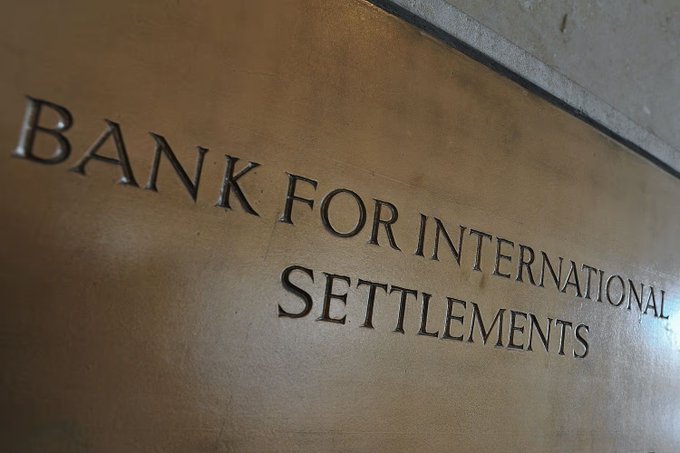 A close-up of engraved metallic lettering on a wall reading 'BANK FOR INTERNATIONAL SETTLEMENTS'.