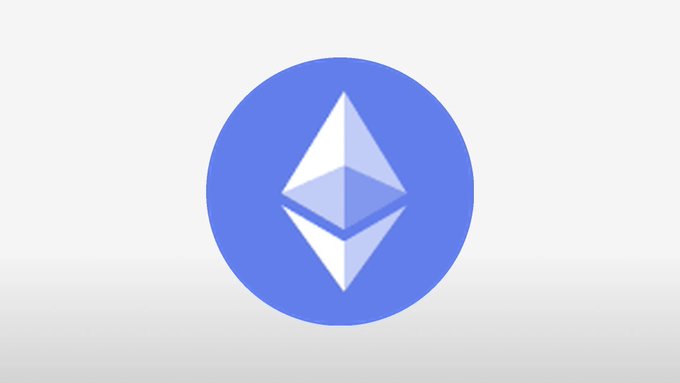 The Ethereum logo, featuring a geometric diamond shape inside a blue circle, is displayed against a light gray background.