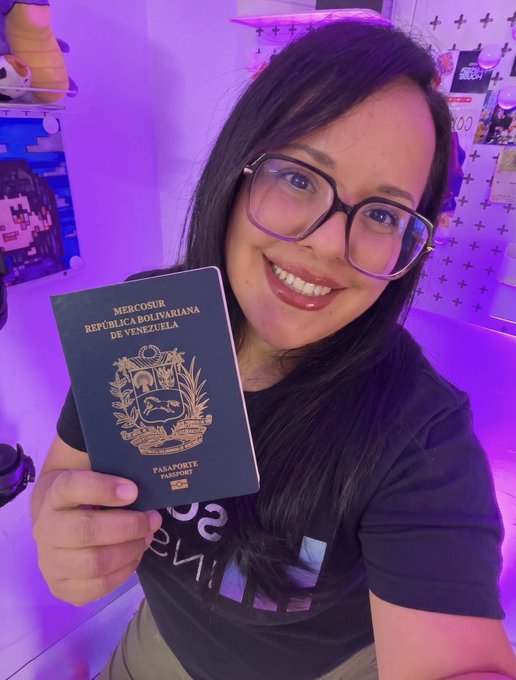 The image features a woman holding up her passport, smiling for the camera. The background of the photo shows a purple wall with various items hanging on it, including a teddy bear and a picture frame. The caption reads "This bad boy and I are ready In 17 days @SuperteamDE will host the Solana Summit Berlin and I'M TALKING: - Founders - Community - Creators - Live perps competition with @JupiterExchange - Tattoo station - Amazing speakers lineup".