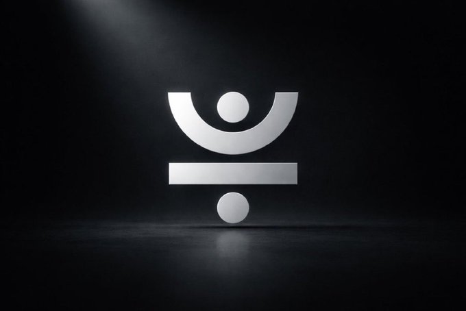 A sleek, silver "JUST" logo is illuminated by a dramatic spotlight against a dark background, reflecting on a glossy floor surface.

The minimalist, spotlighted logo visually reinforces the post's message about JustCrypto's quiet, performance-driven presence as a foundational pillar of the TRON DeFi ecosystem.