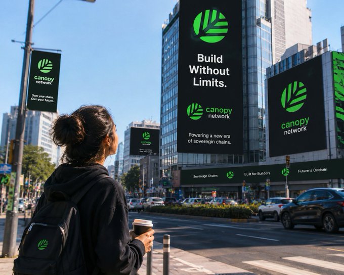 A woman holding a coffee cup looks up at multiple large billboards in a city advertising "canopy network" with slogans "Build Without Limits." and "Powering a new era of sovereign chains."