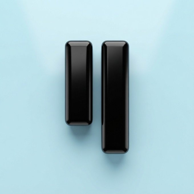 Two glossy black rectangular pillars of different heights are displayed against a light blue background.