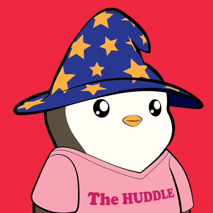 A cartoon penguin character wears a blue wizard hat decorated with yellow stars and a pink shirt that reads 'The HUDDLE' against a red background.