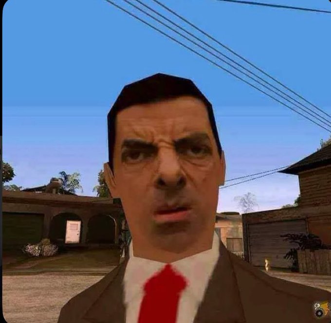 The image shows a close-up of Mr. Bean's surprised and slightly perplexed facial expression, as rendered in what appears to be Grand Theft Auto: San Andreas. His bewildered look humorously mirrors the post's question about whether memecoins have become the new meta in crypto, capturing that same "wait, what?" reaction many feel toward the memecoin trend.