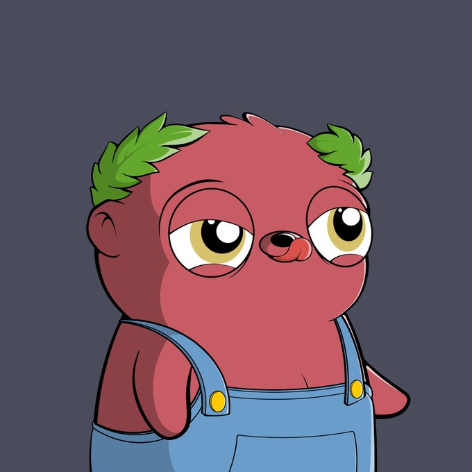 A cartoon illustration of a small, round, reddish-purple bear-like creature with green tufts of hair on its head, wearing blue overalls with yellow buttons against a gray background.