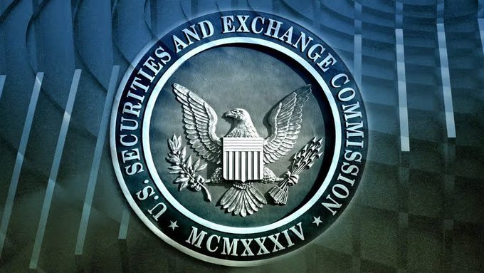 The image shows the official seal of the U.S. Securities and Exchange Commission (SEC), featuring an eagle and the Roman numerals "MCMXXXIV" (1934), set against a backdrop of skyscrapers. It directly relates to the post by visually representing the regulatory body whose delayed tokenization exemption decision is hindering the convergence of Wall Street and crypto markets on tokenized assets.