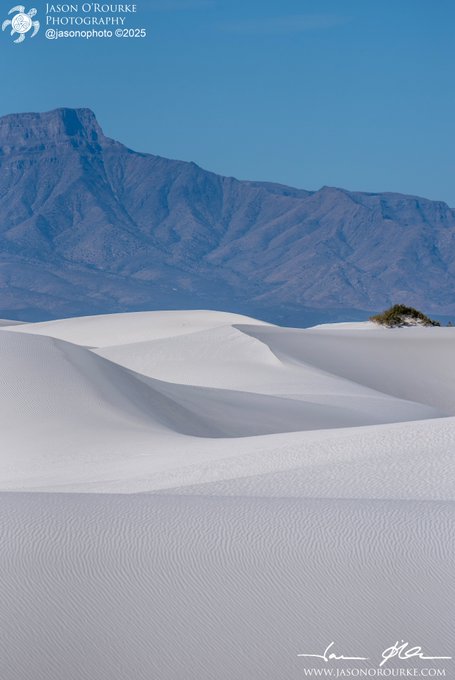 White Sands National Park dunes stretch across the foreground beneath a rugged mountain range under a clear blue sky, with the image watermarked "Jason O'Rourke Photography @jasonophoto ©2025" and "WWW.JASONOROURKE.COM."

The image appears to be a stock landscape photo unrelated to the post's topic about reserving tokens, suggesting the accompanying text about "Reserve set on the new tokens" is mismatched with the visual content.