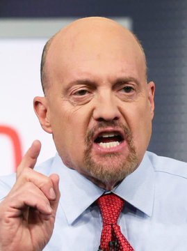 A bald man in a light blue dress shirt and red tie is captured mid-speech, his mouth open and his right index finger raised emphatically as he makes a passionate point. The image illustrates the post's quote from financial commentator Jim Cramer, visually conveying the urgent, direct advice he is known for delivering on investment decisions—in this case, advocating for Bitcoin over derivatives.