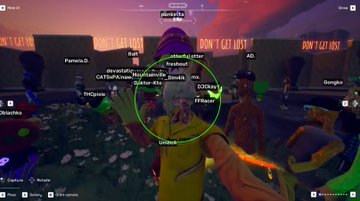 The image shows a video game screen with a group of people playing a game, possibly a fighting game or a roleplaying game like Dungeons & Dragons. The players are wearing different colored clothing, including yellow and green outfits. There are also several other characters visible in the scene, indicating that this is likely an online multiplayer game. A player's name tag can be seen on the screen, suggesting they might have joined the game session or are interacting with others within the game.