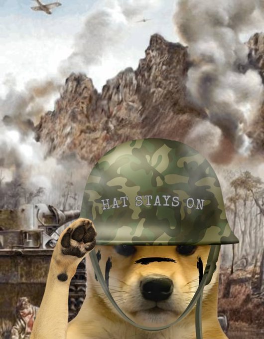 A Shiba Inu dog wearing a camouflage military helmet with 'HAT STAYS ON' written on it, set against a war-torn battlefield background with explosions and aircraft.