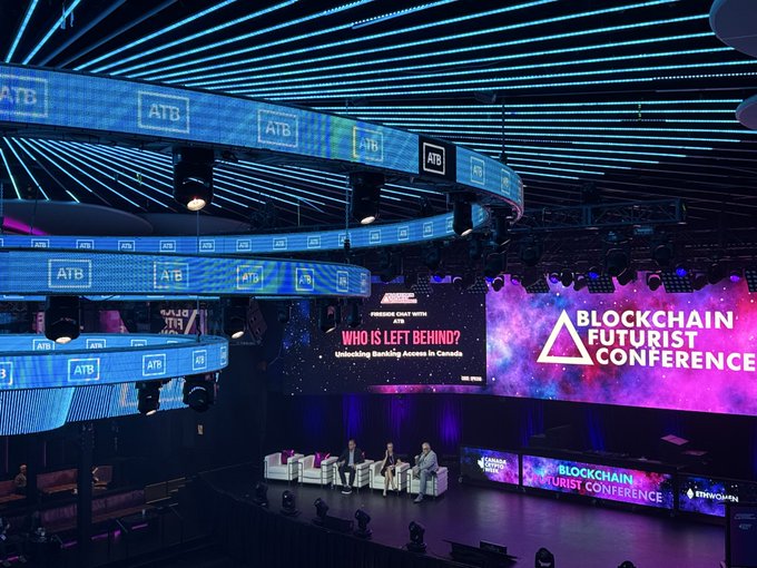 A panel discussion at the Blockchain Futurist Conference, featuring a stage with the title 'WHO IS LEFT BEHIND? Unlocking Banking Access in Canada' and 'ATB' branding throughout the venue.