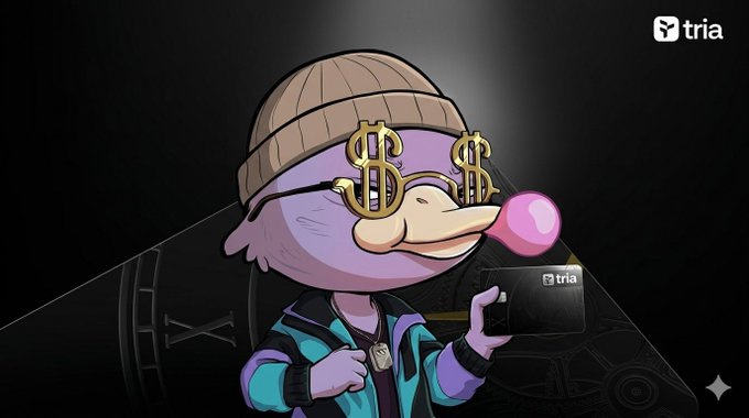 The image features a cartoon duck wearing glasses, a beanie hat, and sunglasses while holding a credit card. The text above the image reads "Good morning champs The @useTria Card transforms your portfolio into a connected financial layer: unified Liquidity - spend across chains from one seamless balance - native yield - invisible infrastructure". This post is about a Trivia game called "@useTria" that allows users to connect their financial data and use it as a linked account.