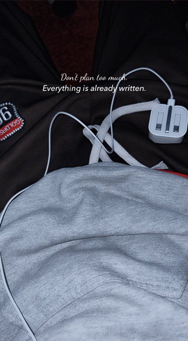 A hooded figure with earphones features the text 'Don't plan too much. Everything is already written.'