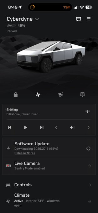 A Tesla mobile app interface for a vehicle named 'Cyberdyne' showing 49% charge, a music player, and a software update downloading at 64%.