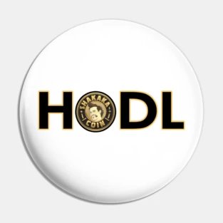A white circular pin or button featuring the word "HODL" in black with a Bitcoin logo replacing the letter "O".