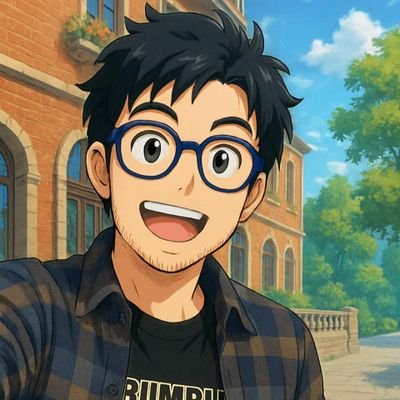 Anime-style illustration of a smiling young man with black hair, glasses, and a plaid shirt standing in front of a brick building.