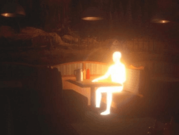 A glowing humanoid figure sits at a diner booth in a dark, atmospheric setting illuminated by warm pendant lights.