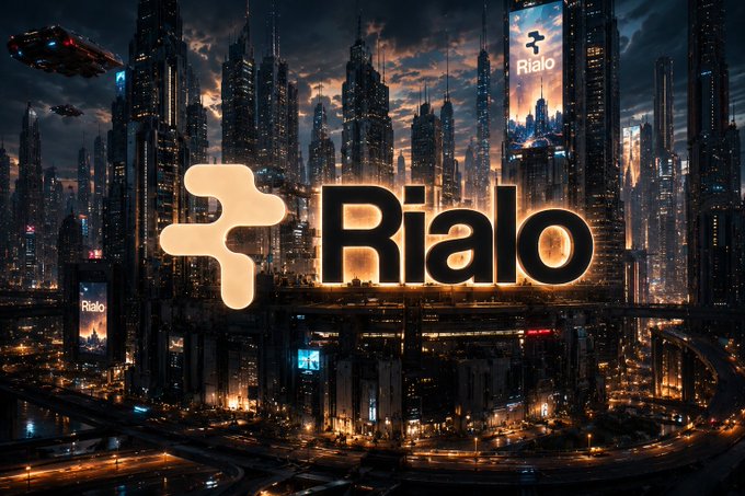 A futuristic city skyline at night with the 'Rialo' logo and branding prominently displayed.