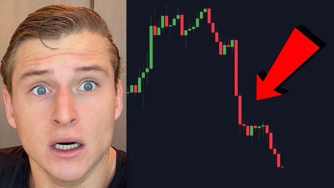 A surprised man appears beside a Bitcoin candlestick chart showing a steep red sell-off, emphasized by a large red arrow. The accompanying post reads, “THIS IS WHY #BITCOIN IS DUMPING... Watch NOW: youtu.be/BrFF-hfRECc.”
