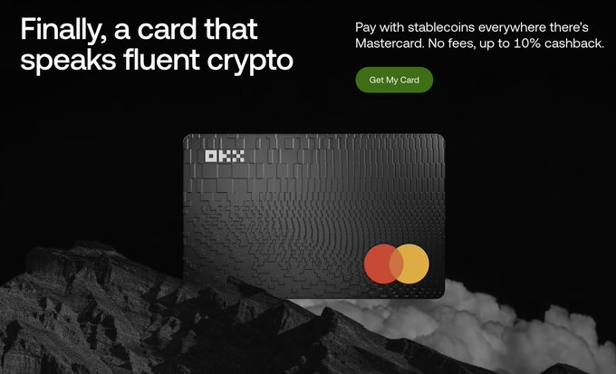 An advertisement for a crypto Mastercard with the headline 'Finally, a card that speaks fluent crypto' and subtext 'Pay with stablecoins everywhere there's Mastercard. No fees, up to 10% cashback,' featuring a black textured card against a dark rocky background.