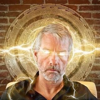 A man with a beard appears in front of a glowing gold circular design with electric energy radiating from his eyes against a brick wall background.