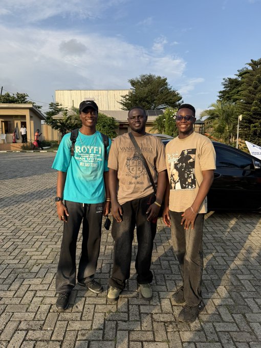 Three men pose together at the Lagos Web3 Hangout event, with the man on the left wearing a teal "ROYFI" t-shirt and the middle man sporting a "Van Gogh" shirt, capturing the community spirit celebrated in the post. The relaxed outdoor setting with paved ground and palm trees reflects the casual networking atmosphere that made the gathering memorable for attendees and sponsors like @CityHubAfrica.