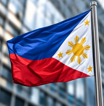 The image displays the Philippine flag waving against a blurred backdrop, symbolizing the nation where a court has frozen 25 crypto wallets and 86 bank accounts tied to a lawmaker in a flood-control plunder investigation, covering 116 assets in total.