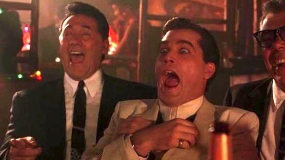 The caption captures a vibrant scene: Three men in suits share a moment of uproarious laughter at what appears to be a lively party or nightclub, with the central figure's exaggerated expression of shock and amusement stealing the spotlight. The accompanying "They called us soltards" caption perfectly complements the image, as the men's uninhibited, gleeful reactions embody the kind of carefree camaraderie often mocked or misunderstood by outsiders, turning an inside joke into a badge of honor.
