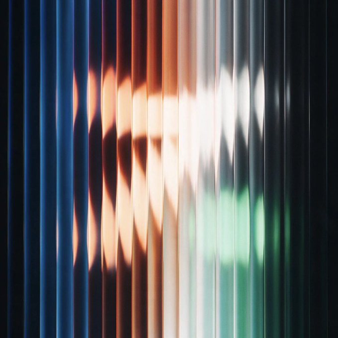 An abstract photograph shows vertical strips of color with warm orange and cool green tones creating a blurred, fragmented pattern.