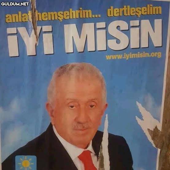 A torn Turkish campaign poster featuring a suited man with a red tie, the slogan "anlat hemşehrim... dertleşelim İYİ MİSİN" ("Tell me, fellow townsman... let's share our troubles, are you okay?") and the website "www.iyimisin.org" — paired humorously with the poster's literal question, "Are you okay?", echoing the poster's poignant question to a weary crypto investor struggling through a brutal market downturn.