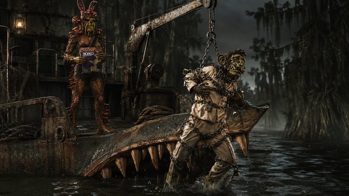 A dark, swampy scene featuring decayed animatronic characters, including a withered fox figure standing on a rusted structure and a chained figure in the water.
