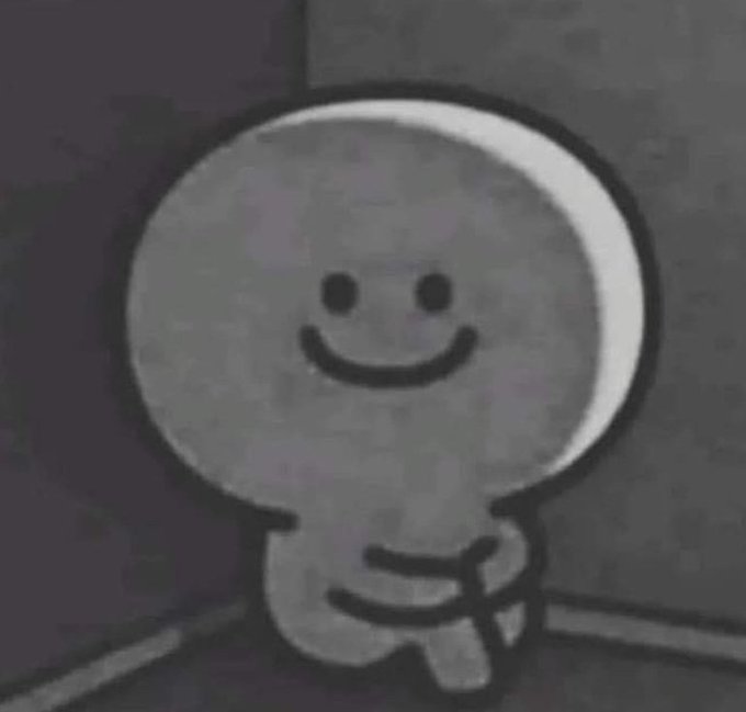 A simple black and white cartoon drawing of a smiling figure with a round head and crossed arms, appearing in a grayscale style.