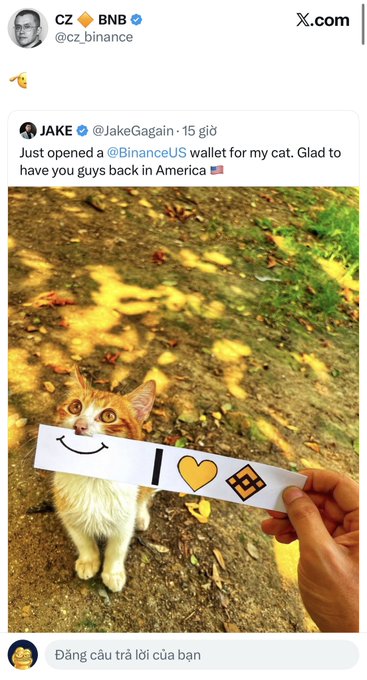 The image shows CZ (Changpeng Zhao, Binance founder) quoting a tweet from @JakeGagain featuring a smiling cat holding a Binance-themed paper wallet, with the caption "Just opened a @BinanceUS wallet for my cat. Glad to have you guys back in America 🇺🇸"—tying into the viral CAT memecoin trend across crypto chains.
