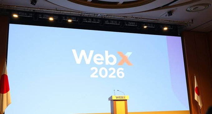 The image shows a stage at the WebX 2026 conference, featuring a podium and large screen displaying the "WebX 2026" branding alongside Japanese flags, visually reinforcing the post's message about Japan's emergence as a welcoming hub for Web3 innovation and startups.