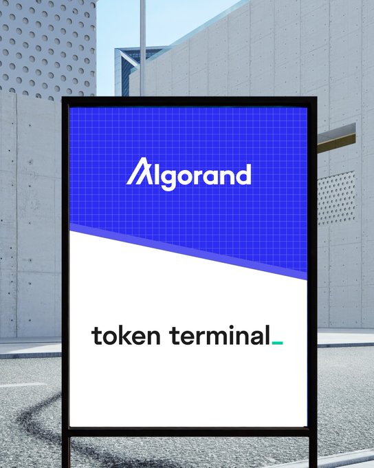 The image features a sign for Algorand, which is an online marketplace that allows users to buy and sell digital assets such as cryptocurrencies, tokens, and other virtual items. The sign displays the name of the platform and its logo on a blue background with white text.