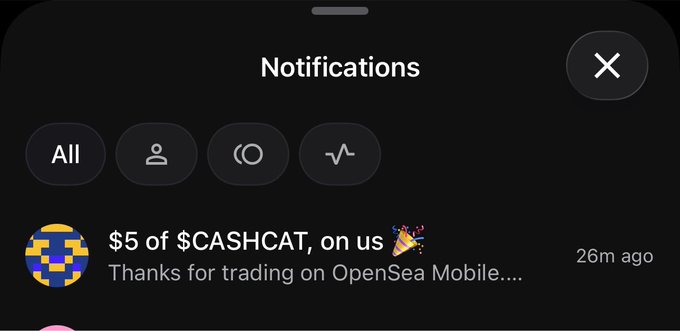 A mobile notifications screen from OpenSea showing a message received "26m ago" stating "$5 of $CASHCAT, on us 🎉 Thanks for trading on OpenSea Mobile," corresponding to the post where the user shares an OpenSea Mobile invite code that awarded them $5 in $CASHCAT tokens.