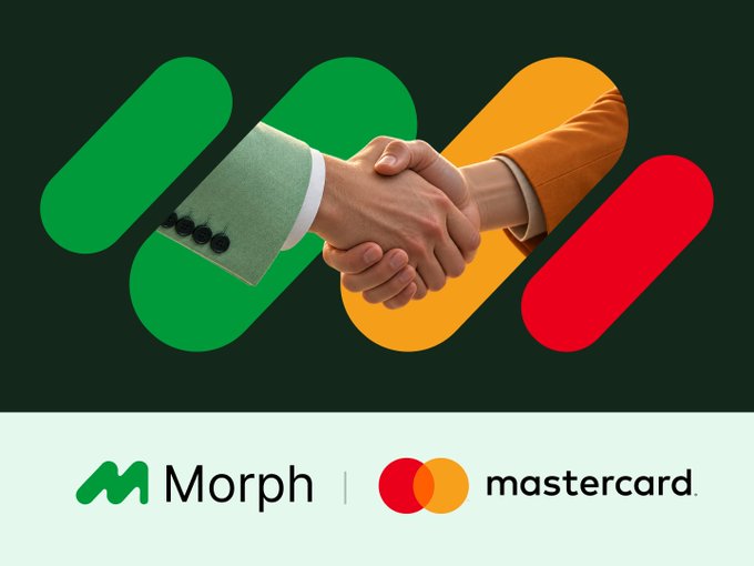 Two hands, one in a green suit and the other in an orange suit, clasp in a handshake against a background featuring green and red pill shapes, symbolizing a partnership between Morph and Mastercard's Crypto Partner Program. The image displays the Morph and Mastercard logos at the bottom, alongside the accompanying text announcing Morph's participation in the global initiative.