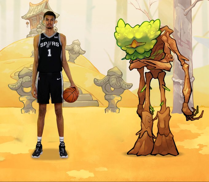 The image features a basketball player standing next to a tree-like creature, possibly a character from a cartoon or comic book. The basketball player is wearing a black jersey with the number 1 and holding a basketball. The caption of the image reads "This is @wemby in @AxieInfinity terms".