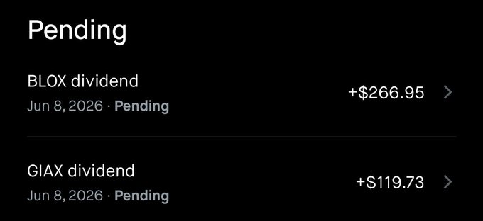 The focus of this image appears to be a screenshot or an illustration related to a discussion about investments, specifically Blox and Giatx dividends. The main subject is an accounting list that shows the dividend amounts received from these two companies on different days - $26.95 on June 8th and $26.77 on July 8th. There are two columns of data: one for each company's dividends. One column contains a dollar amount, while the other has a date. The image also includes text that refers to these two companies as 'BLOX' and 'Giatx', both implying they are involved in the investment discussion. The image seems to be part of a larger piece of content or a conversation about investing and dividends related to these specific companies.
