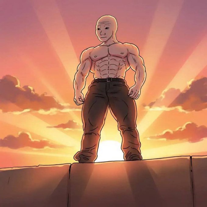 The image features a muscular man standing on top of a cliff, with the sun setting behind him. The man appears to be wearing a belt around his waist and has a serious expression on his face. The background shows a beautiful sunset, adding to the overall atmosphere of the scene.
