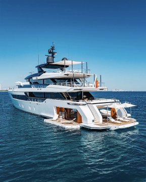 A sleek, multi-deck luxury yacht floats on calm blue waters under a clear sky, showcasing modern maritime opulence. The image visually represents the post's theme of a "New yacht thanks to Ethereum," symbolizing the wealth generated from cryptocurrency investments being used to purchase high-end luxury vessels.