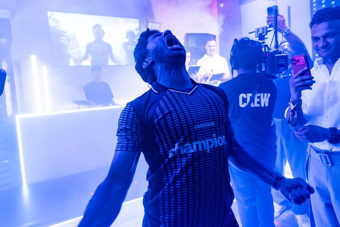 A man in a "Champion" jersey and a "CREW" shirt member throw their heads back laughing in a blue-lit room while a man in white films them with his phone. The joyful, celebratory mood visually reflects the post's note of a small "1% bounce overnight"—a minor positive movement worth celebrating with relief and excitement.