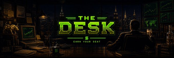 A banner image titled "THE DESK" with the tagline "EARN YOUR SEAT" in green neon-style text, showing a man at a desk with trading screens overlooking a nighttime city skyline.