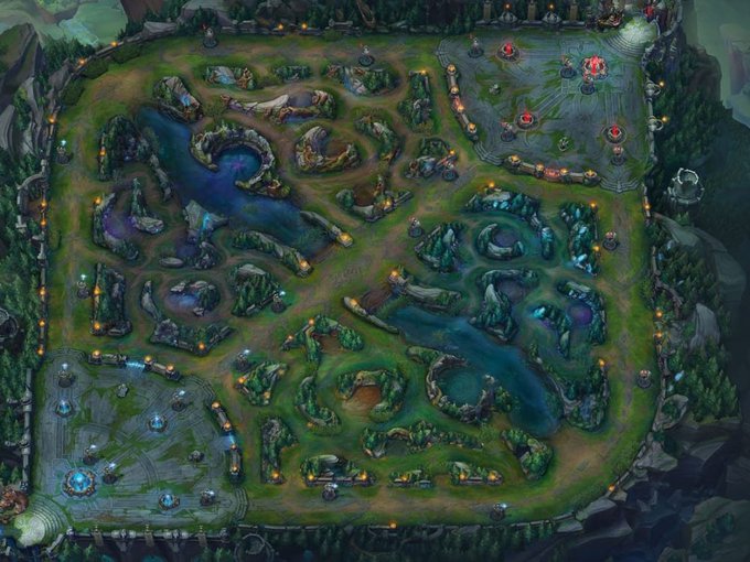 Aerial view of the Summoner's Rift map from League of Legends, showing lanes, jungle areas, bases with red and blue structures, and rivers winding through the battlefield.