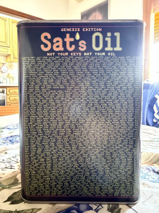 The image features a black tin can with white text that reads "genesis edition sat's oil not your keys not your oil". The can has been placed on top of a table, possibly in front of a window or other background elements. There is no visible text or objects related to the post about spending Sats should I move back to italy.